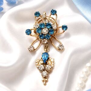 Vintage Mid Century Gold Tone Blue Rhinestone Floral Like Brooch Pendant